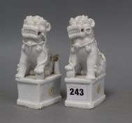 A pair of Chinese blanc de chine Buddhist lion joss-stick holders, losses