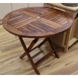 A teak folding garden table Diameter 90cm