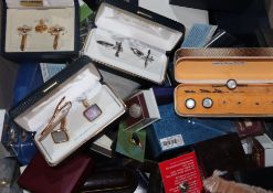 A large quantity of assorted cufflinks and tie pins, some silver