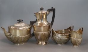 A Victorian matched demi-fluted silver four piece tea set, London and Sheffield 1898/9, maker's