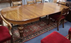 A Victorian mahogany extending dining table 230cm extended (two spare leaves)