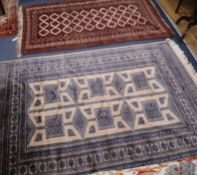 A Pakistan beige ground rug and a Belouchistan ivory ground rug Larger 190 x 130cm