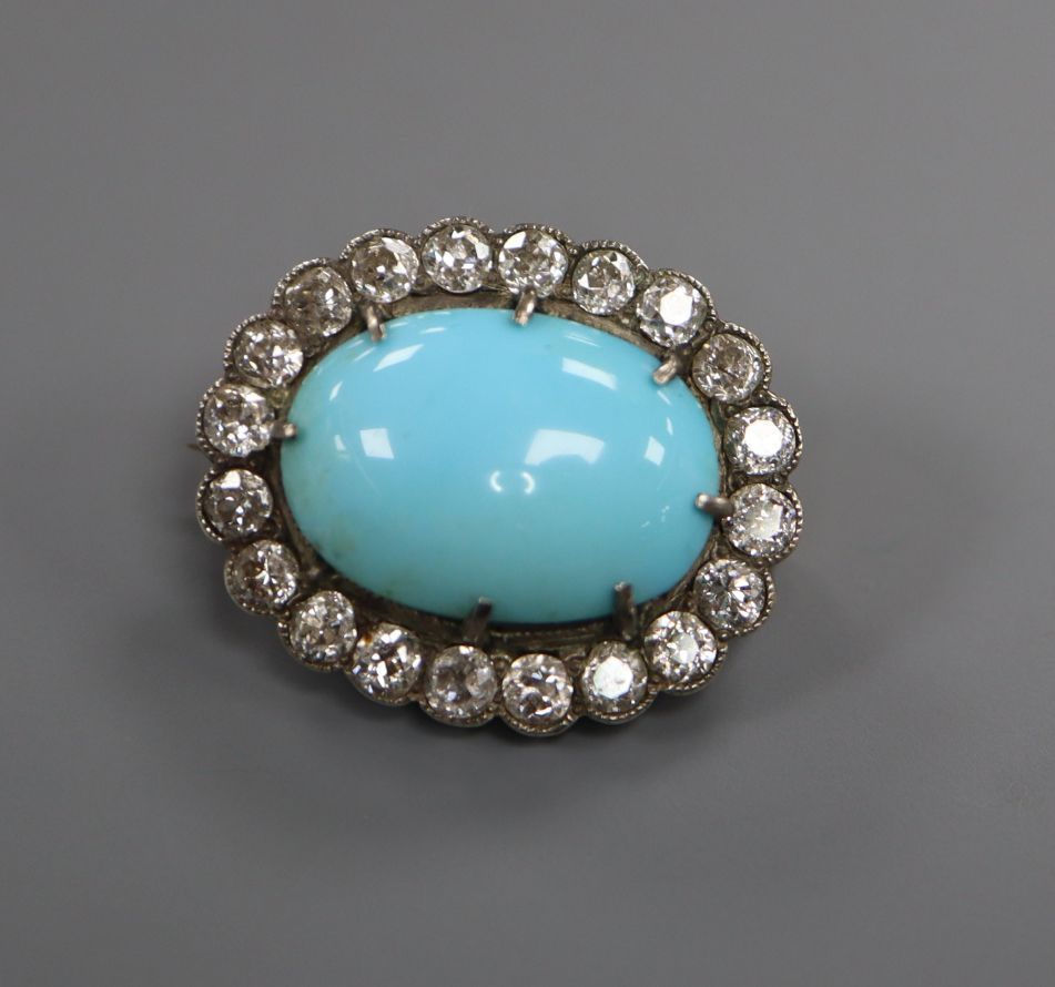 A Victorian yellow metal brooch, with oval turquoise cabochon surrounded by old-cut diamonds, 23mm.