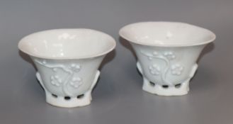 A pair of 18th century Chinese blanc de chine 'prunus' libation cups