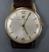 A gentleman's 9ct gold Girard Perregaux manual wind wrist watch, with associated leather strap, with