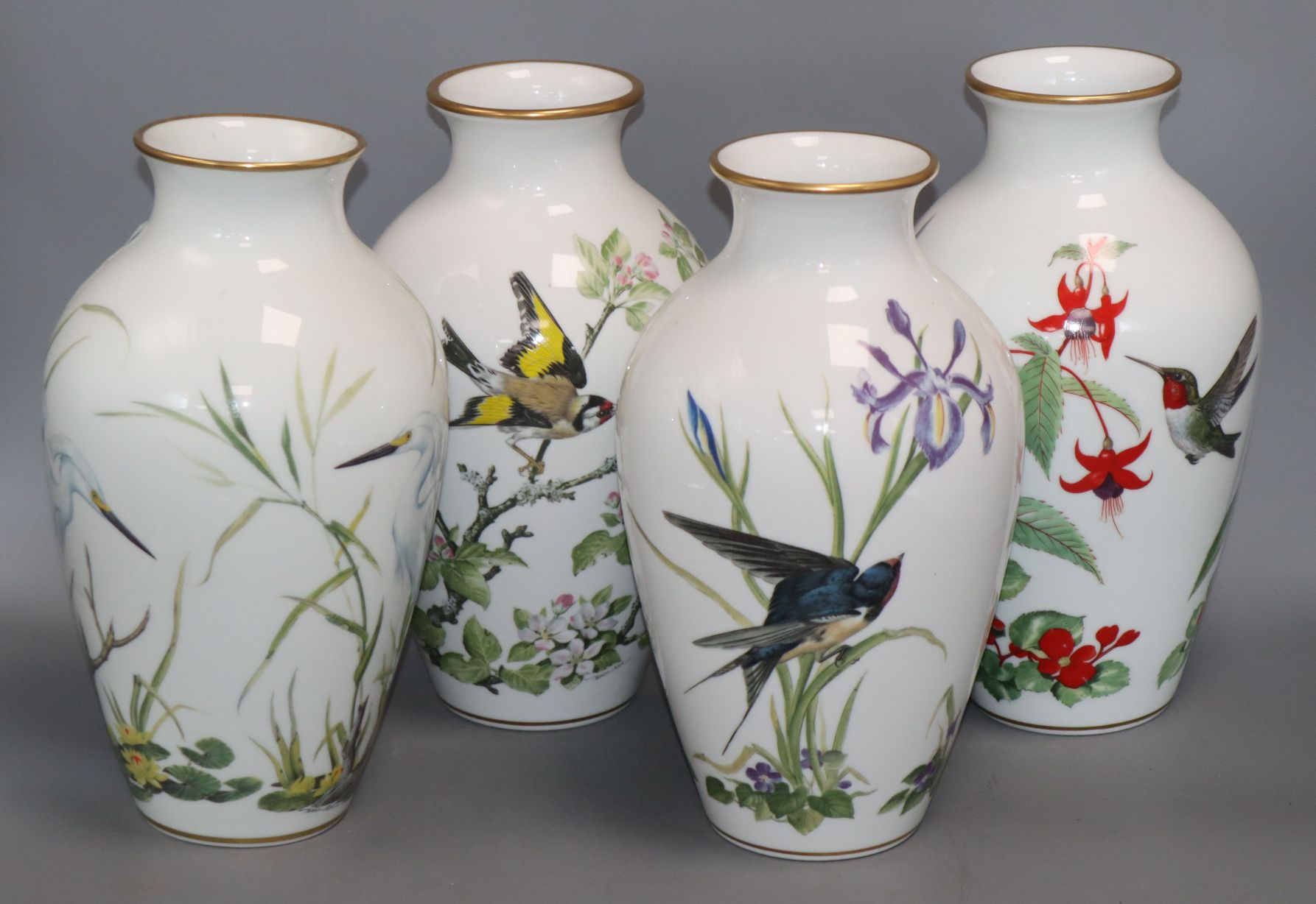 A set of four Franklin porcelain bird vases