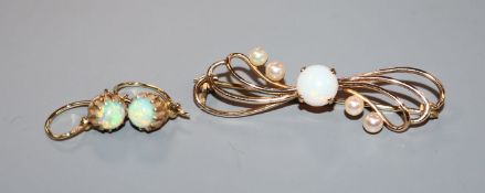 A 9ct gold, white opal and seed pearl brooch and a pair of yellow metal and white opal earrings.