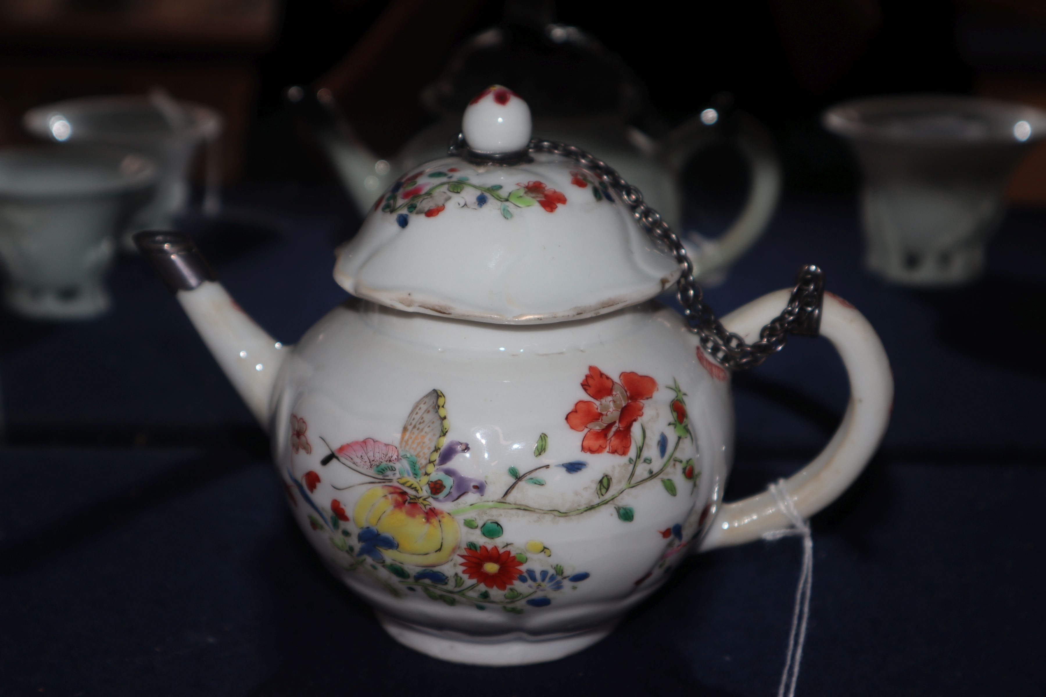 A Chinese famille rose teapot and cover, Qianlong, metal repair to spout, and a Batavia saucer - Image 4 of 9