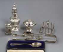 Mixed silver including mustard, pepperette, toastrack, tongs, spoon etc.