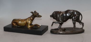 A 19th century bronze figure of a recumbent greyhound and a spelter figure of a greyhound