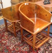 A pair of Chinese elm tub chairs