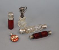 Two white metal mounted glass double ended scent bottles, a salts bottle, small ewer and silver