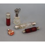 Two white metal mounted glass double ended scent bottles, a salts bottle, small ewer and silver