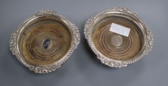 A pair of George IV silver decanter coasters, London 1820 by Samuel Hennell, 16.7 cm.