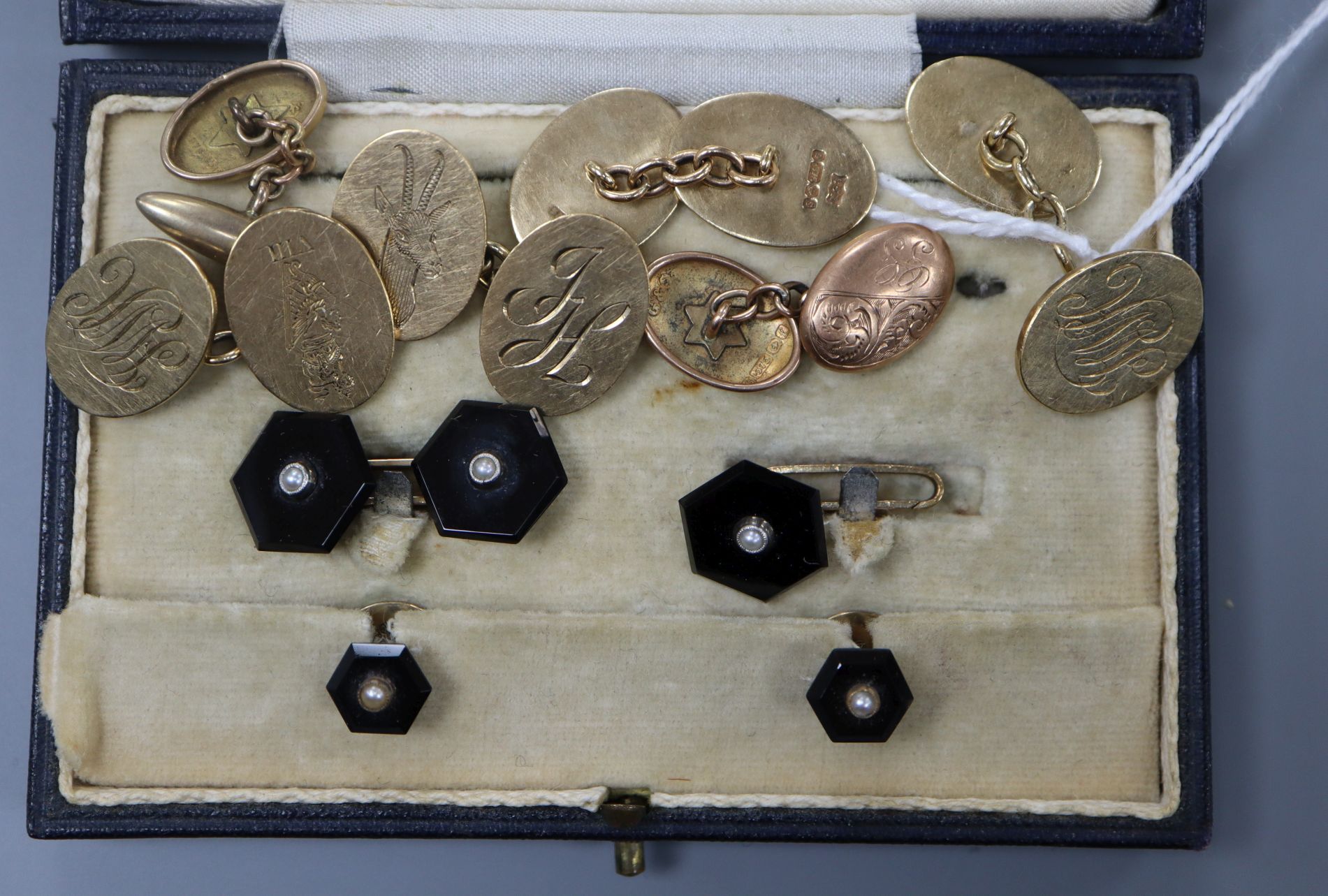 Three assorted pairs of 9ct gold cufflinks and a black onyx part dress stud set.