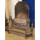 A cast iron fire grate, together with an iron fender W.64cm