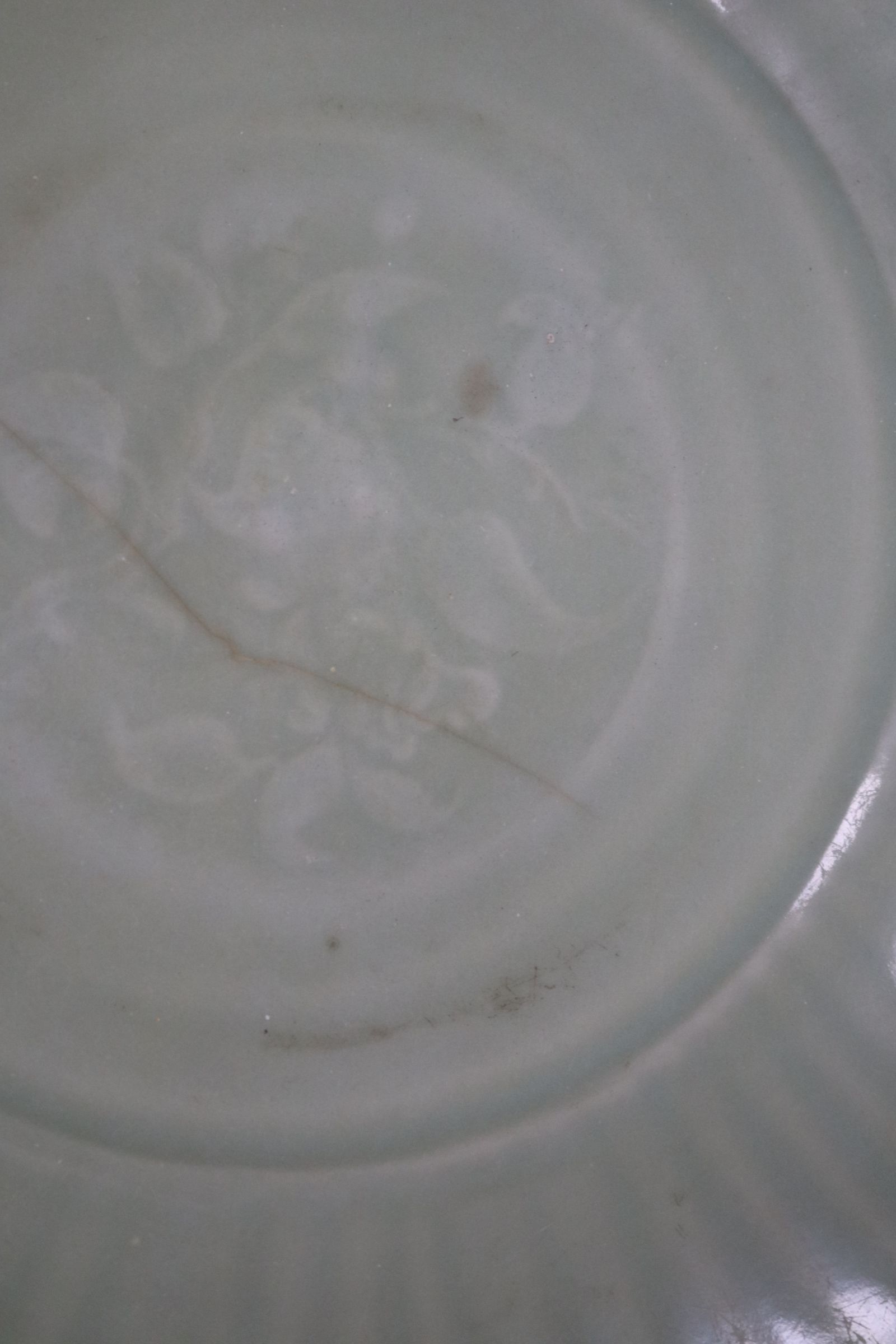 A Chinese Longquan celadon dish, Ming - Image 3 of 5