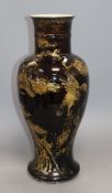 An 18th century Chinese gilt decorated mirror black glazed baluster vase, drilled hole