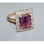 An 18ct and plat, amethyst and diamond set square cluster ring, size U.