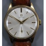 A gentleman's 1950's 9ct gold Omega manual wind wrist watch, on leather strap with Omega buckle,