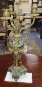 A French marble and gilt metal three branch candelabra