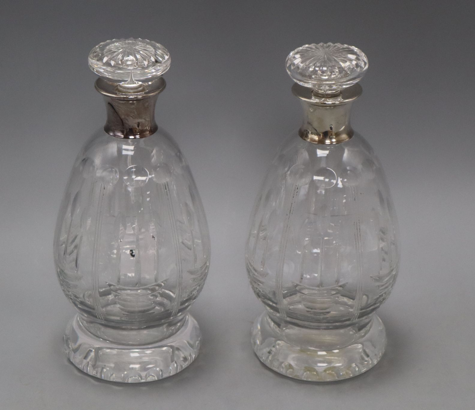 A pair of silver mounted decanters