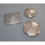 A silver cigarette case and two compacts.