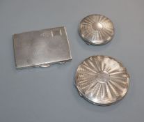 A silver cigarette case and two compacts.