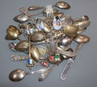 A quantity of assorted sterling flatware and assorted 800 gilt white metal commemorative spoons.