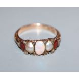 A Victorian 15ct, graduated white opal, split pearl and topaz? set half hoop ring, size O.