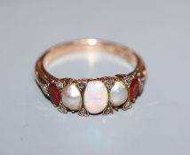 A Victorian 15ct, graduated white opal, split pearl and topaz? set half hoop ring, size O.