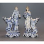 A pair of Continental porcelain figural spill vases