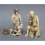 Two Japanese ivory okimono of figures with children, one signed to a red lacquer tablet, Meiji