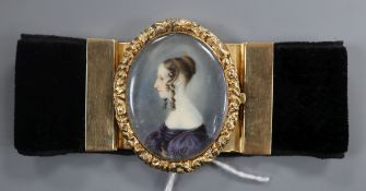 A Victorian yellow metal mounted black sash bracelet, the central clasp with miniature oval portrait