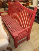 A red painted wooden garden bench W.205cm