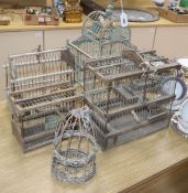Five vintage Spanish wood and cane bird cages