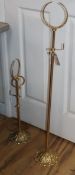 A pair of French gilt metal hat and scarf stands