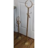 A pair of French gilt metal hat and scarf stands