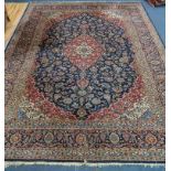 A Kashan style blue ground carpet 360 x 270cm