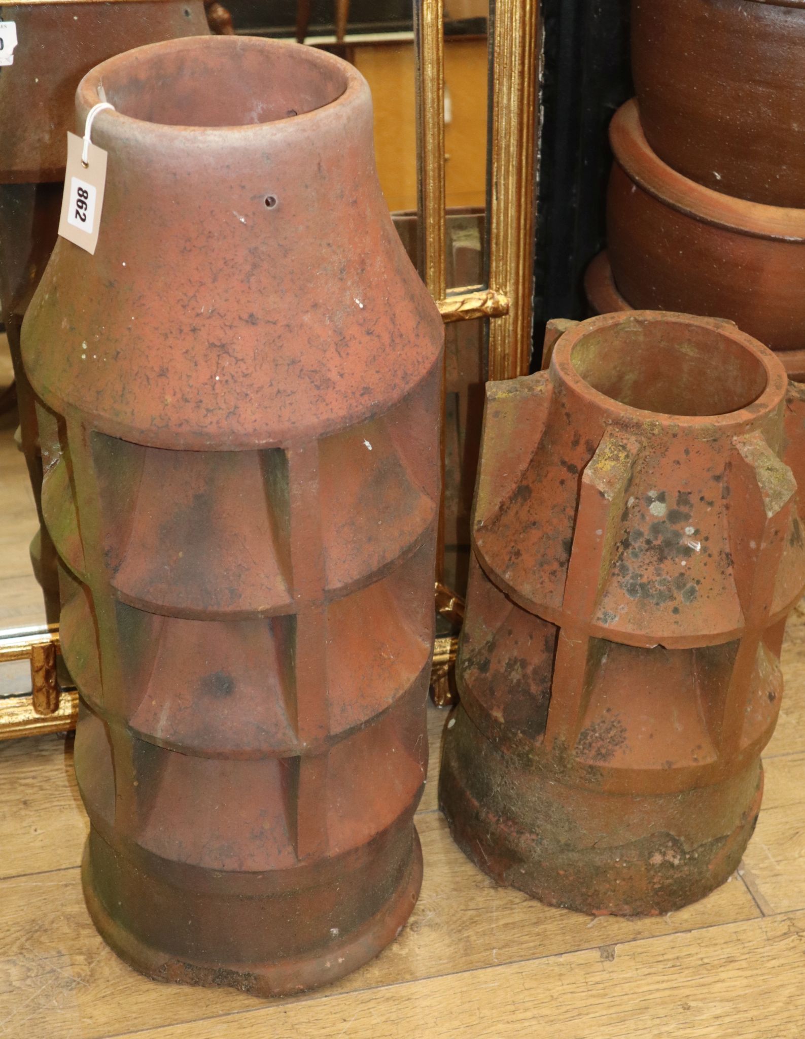 Two terracotta chimney pots largest H.74cm