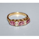 An 18ct gold, pink sapphire and diamond half-hoop ring, size M.