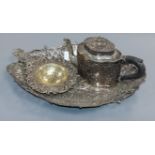 A continental pierced white metal dish, a similar strainer and a Hanau? bachelor's teapot, 14 oz.