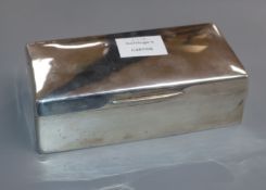 A George V silver cigarette box, London, 1920, 17.6cm.