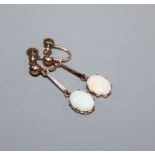 A pair of early 20th century yellow metal and white opal set drop ear clips, 34mm.