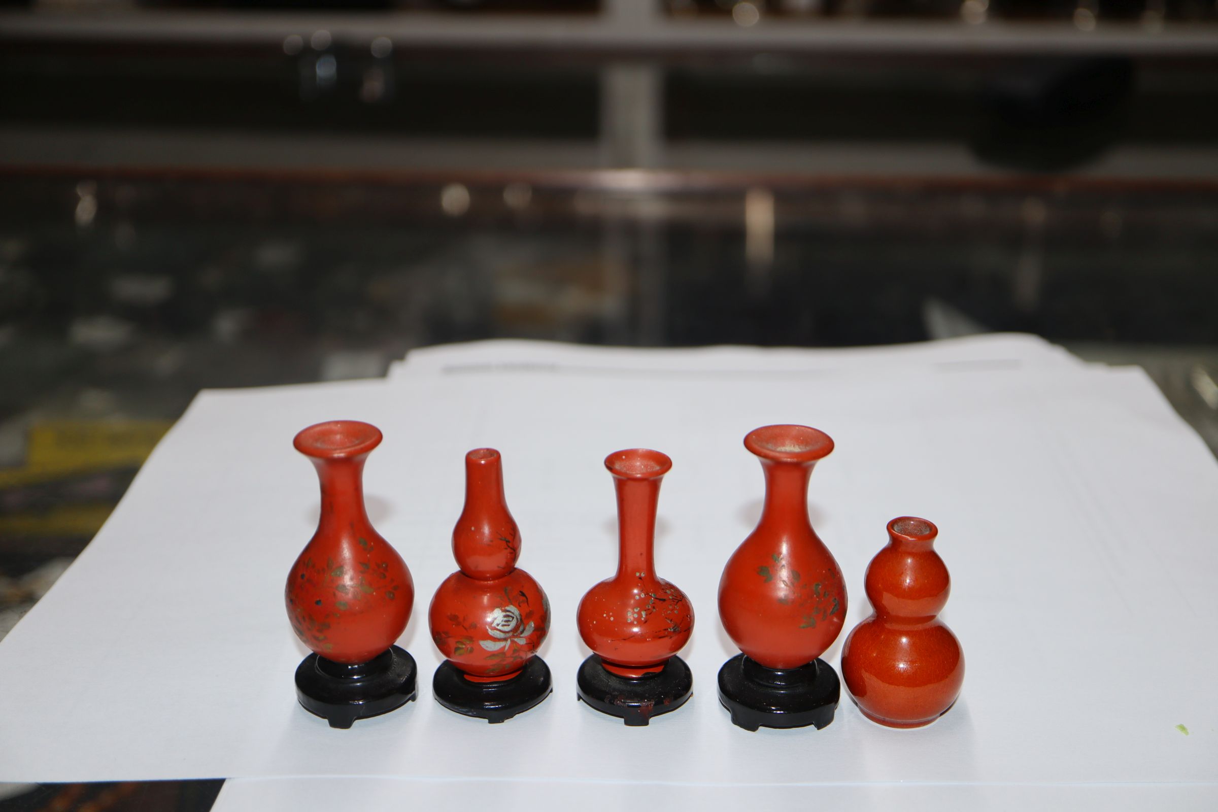 A group of four Chinese lacquer wood miniature vases and a similar pottery double gourd vase (5) - Image 5 of 7