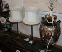 Two ceramic table lamps and shades and a pair of lamps