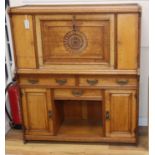 A Victorian Arts & Crafts oak writing cabinet by Maple & Co W.107cm
