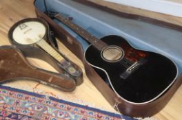 A Martin Coletti acoustic guitar and a John Grey banjo mandolin