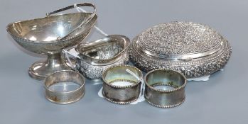 An Indian white metal embossed oval box, a Victorian silver salt and four other items.