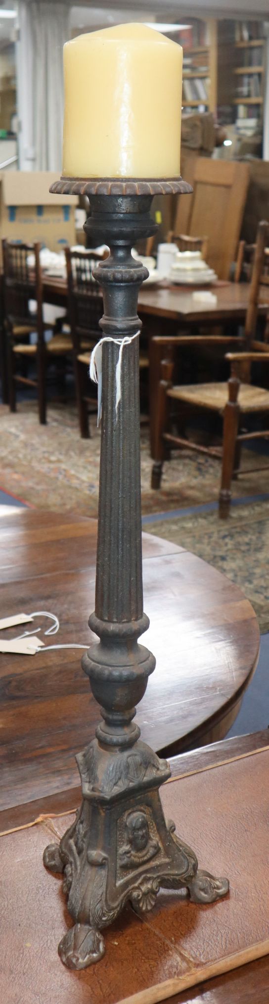 A Florentine style cast iron candle stand